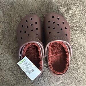 Never worn burgundy classic lined Crocs
